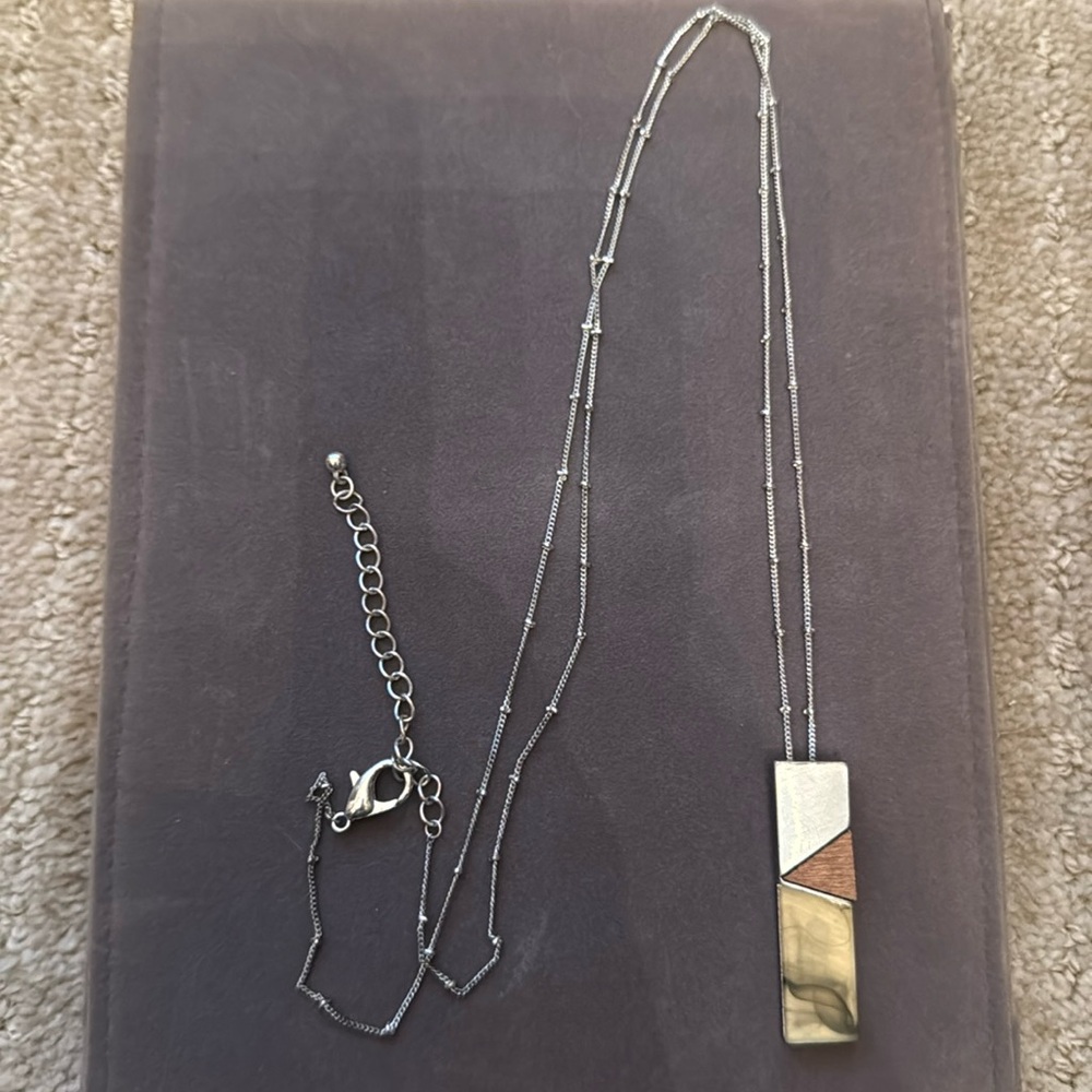 Pretty wood/metal/stone look pendant long necklace. Long Silver chain.